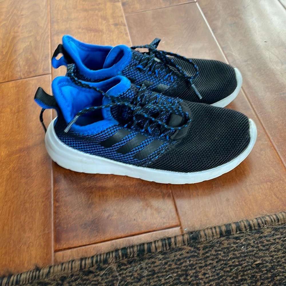 Black and blue adidas sneakers.